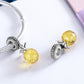 Pineapple love charm pair on silver bracelet cord with faceted yellow pineapple beads
