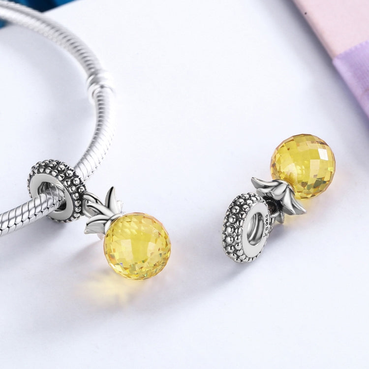 Pineapple love charm pair on silver bracelet cord with faceted yellow pineapple beads