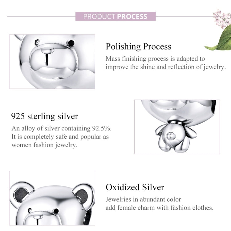 Sterling silver bear charm bead close-up with polished highlights and small baby-bear
