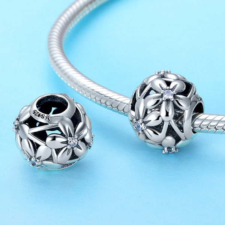Sterling silver flower charm beads set with dripping-oil motif and clear center stones