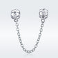 Sterling silver safety chain with two charm beads, visible round crystal accents
