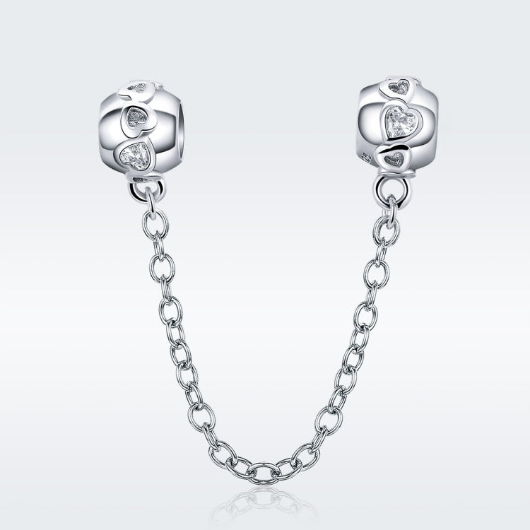 Sterling silver safety chain with two charm beads, visible round crystal accents