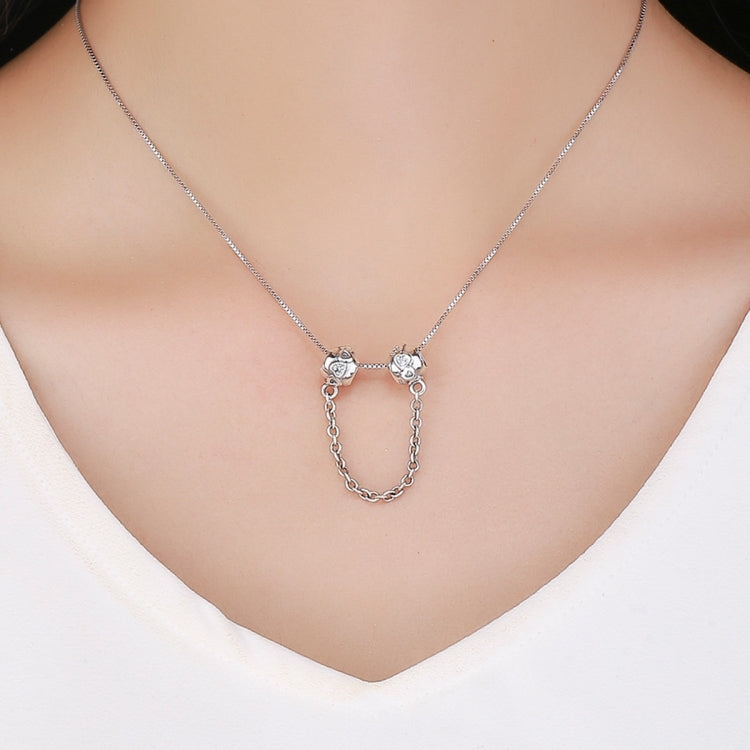 Sterling silver safety chain necklace with two charm beads on a fine chain