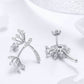 Dandelion CZ earrings, silver-tone with stud back and curved sparkling drop
