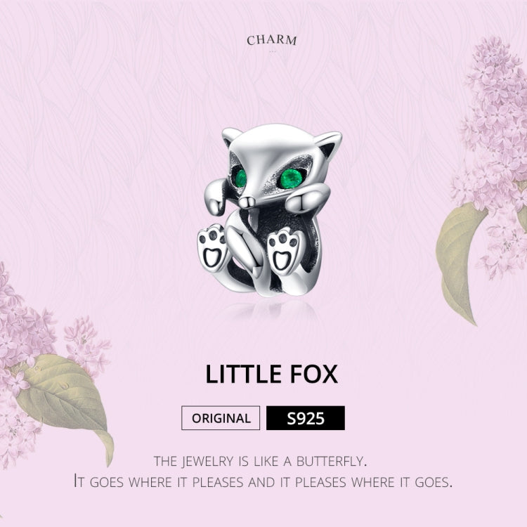 Little fox charm bead in oxidized silver with green eyes and paw print accents
