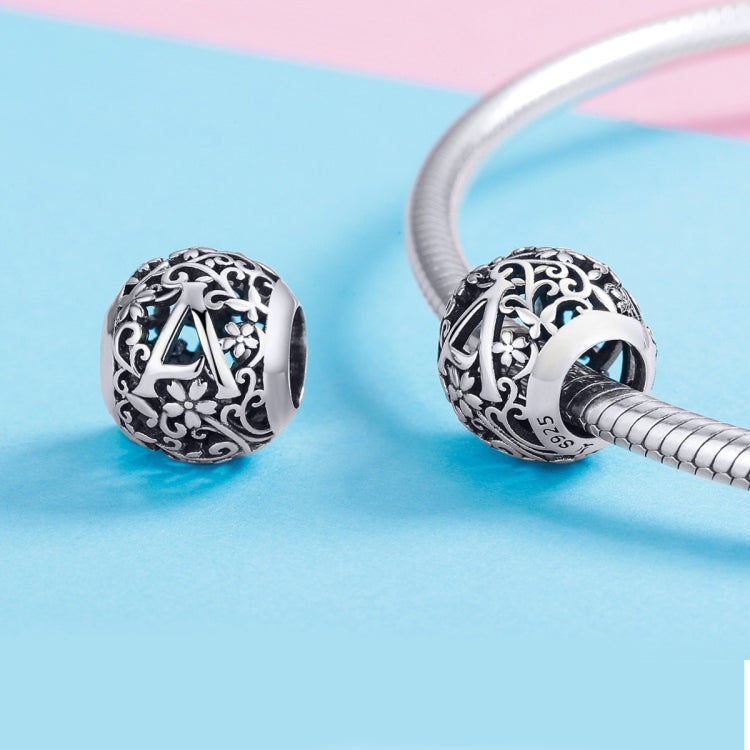 Two sterling silver letter beads with black enamel and ornate floral scrollwork for bracelet
