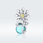 Sterling silver daisy charm bead with yellow crystal center and teal glass accent