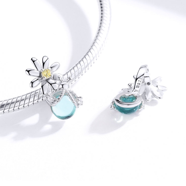 Sterling silver bracelet with daisy charm bead and teal glass oval drop