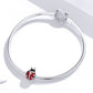 Ladybug charm bead on silver snake chain bracelet with oxidized silver details