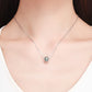 Silver necklace chain with round clover pendant bead set with green stones