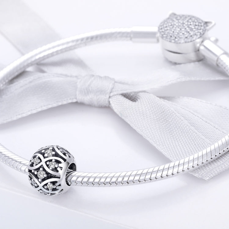 Sterling silver charm bead with black enamel and crystal stones on silver snake bracelet