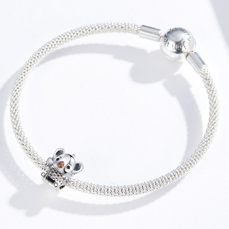 Silver charm bracelet featuring a baby koala bead with brown nose and paw prints