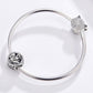 Silver bracelet with clasp and rose charm bead on a mesh chain