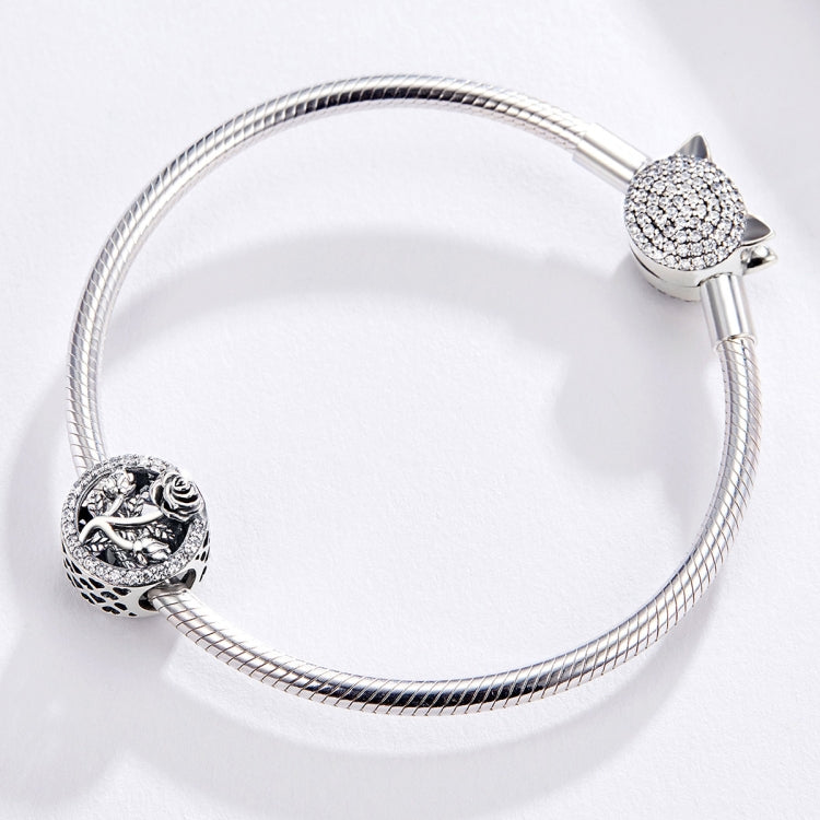 Silver bracelet with clasp and rose charm bead on a mesh chain