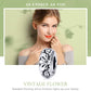 Sterling silver flower-pattern bead charm held near neckline, oxidized swirl details