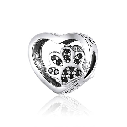 Heart-shaped sterling silver bead with black zircon paw print detail