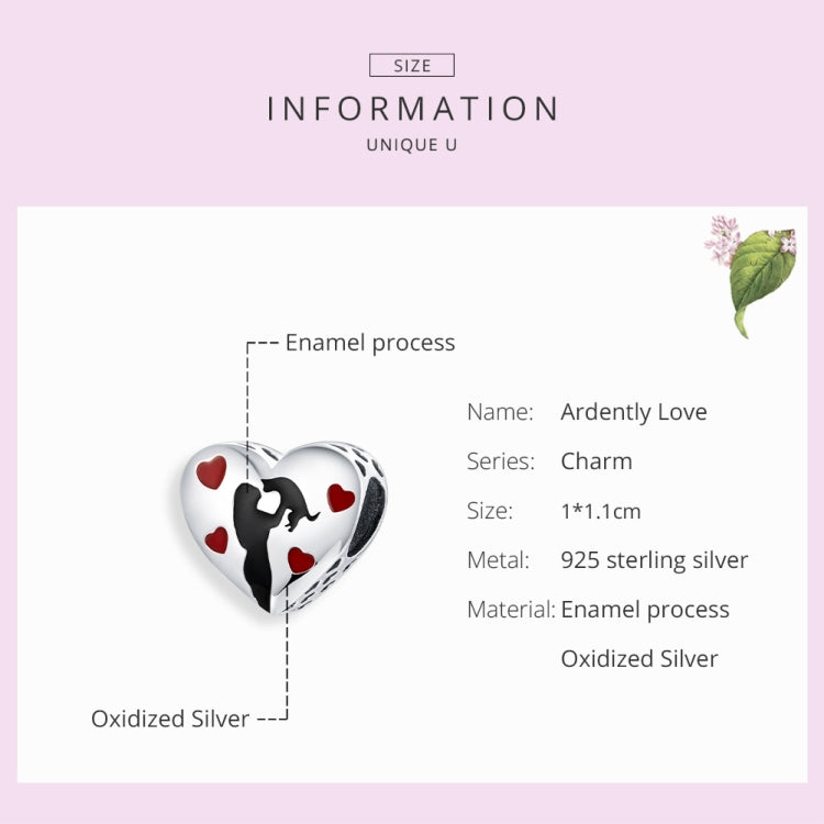 Heart-shaped charm with black silhouette and red heart enamel details on oxidized silver