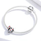 Beaded silver bracelet with heart-shaped charm featuring black silhouette and red enamel hearts