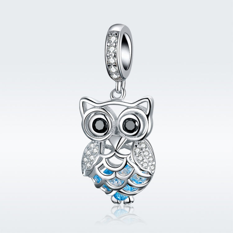 Sterling silver owl pendant charm with blue enamel wings and sparkling rhinestone eyes