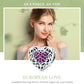 Sterling silver heart-shaped bead charm with pink stones and filigree scrollwork