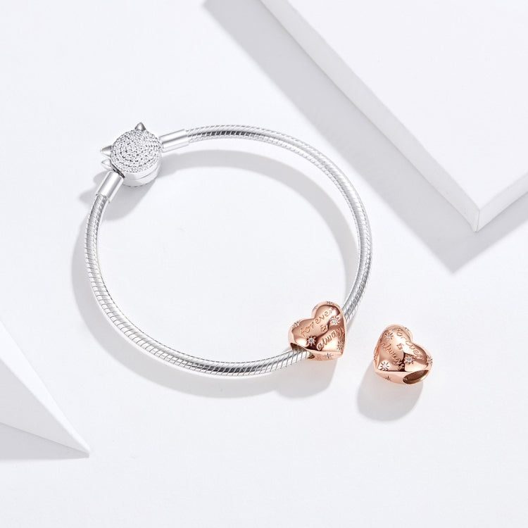 Silver snake bracelet with a top silver CZ heart charm and a rose gold heart bead charm