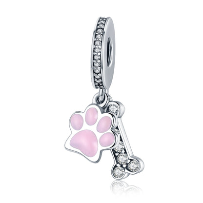 Sterling silver dog paw charm bead with pink enamel and clear CZ accents
