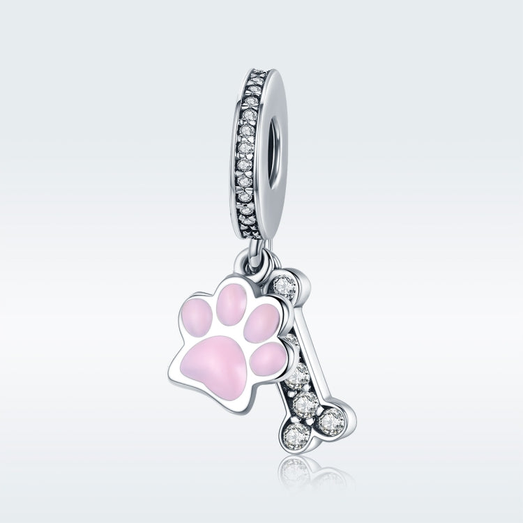 Paw-print charm bead with pink enamel center and clear CZ stones on silver ring