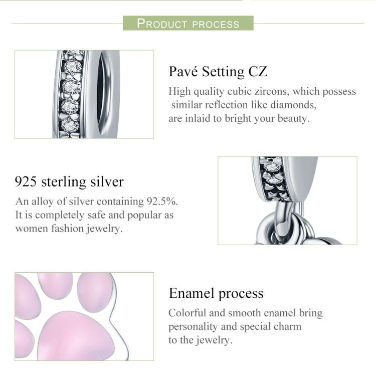 Dog paw charm bead detail on silver ring with clear CZ stones and pink enamel