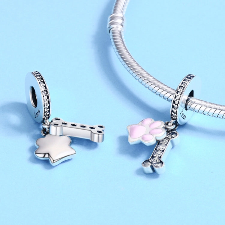 Silver bracelet beads with pink paw charm plus CZ bone and star charms