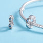 Sterling silver eye bead charm with blue stones on a bracelet