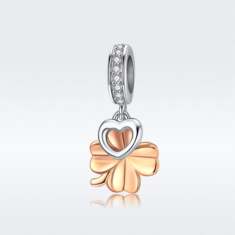 Clover pendant charm with rose-gold petals, heart detail, and sparkling CZ bezel