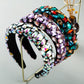 Wide embellished headband with purple and teal rhinestones