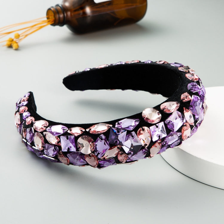 Wide circular headband with purple rhinestones and black velvet lining
