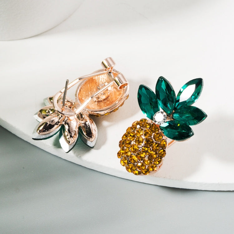 Rhinestone pineapple stud earrings, gold body with green leaves and rose-tone sparkle