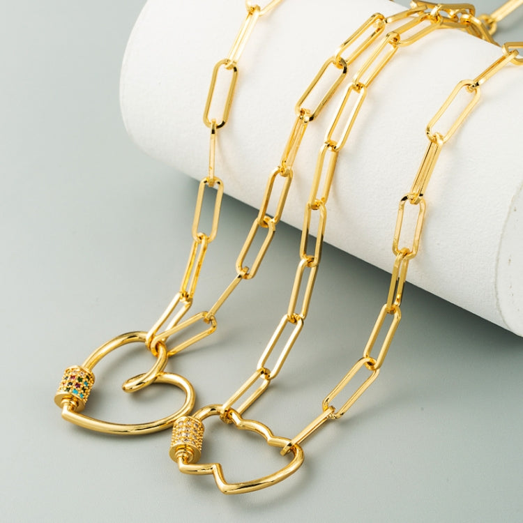 Gold-tone heart pendant necklace set on multiple chain lengths with multicolor zircon charms