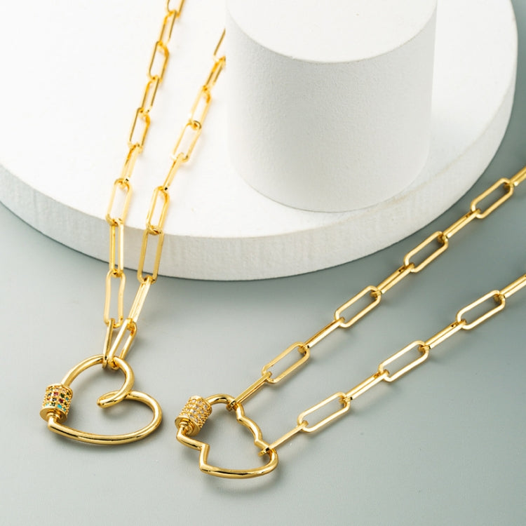 Gold-tone double heart pendant necklace with multicolor zircon accents on curved charms