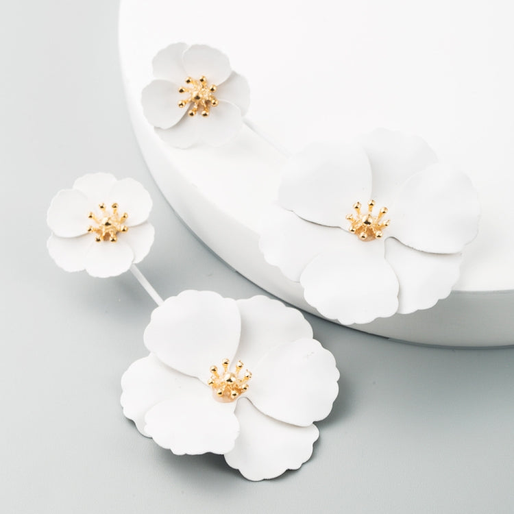White triple-flower drop earrings with gold-tone centers, long dangling alloy design