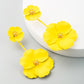 Yellow triple-flower drop earrings with gold-tone centers, long dangling alloy design