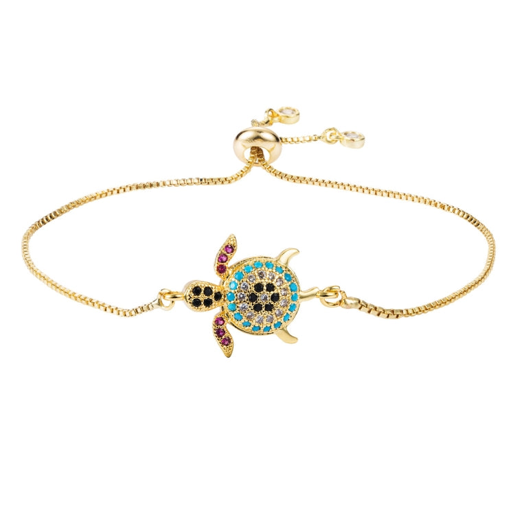 Gold-tone turtle charm bracelet with multicolor zircon-stone details and adjustable clasp
