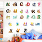 Alphabet animal wall stickers on a white wall, colorful uppercase letters A–Z