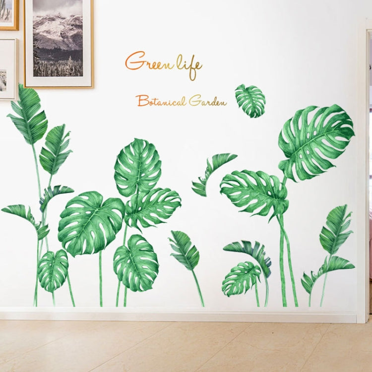 Green tropical leaf wall stickers spread across an indoor wall