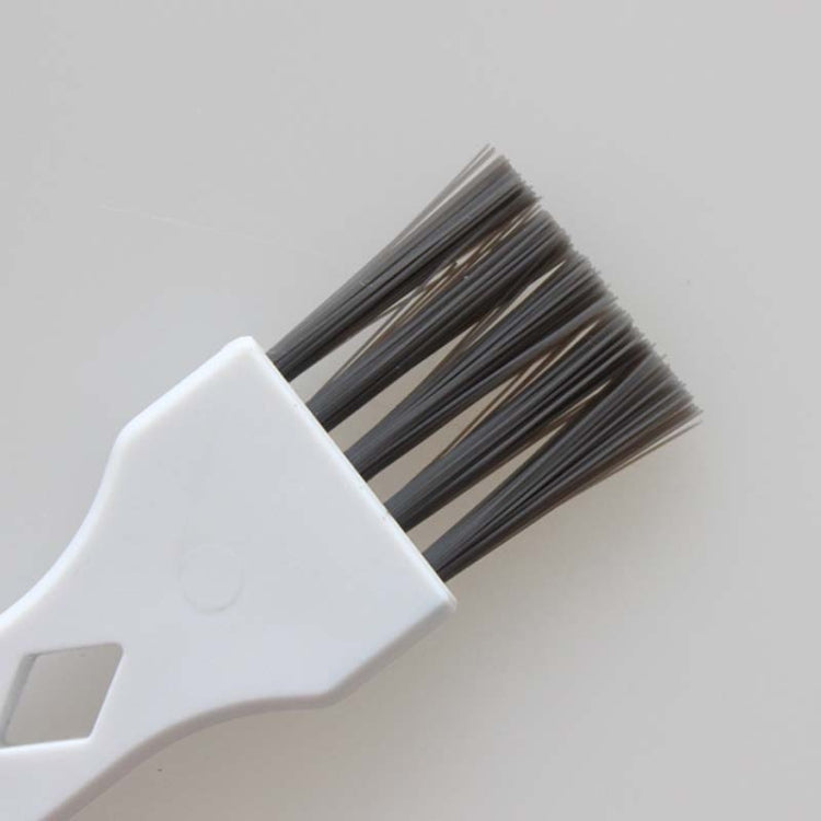 White bristle brush head with dark bristles for robot vacuum cleaning
