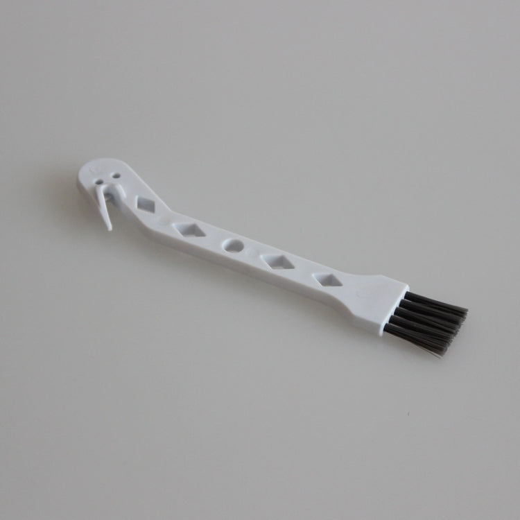 White small vacuum brush with dark bristles and clip end