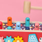 Close-up of red wooden percussion cart top with animal pegs and patterned drum panel