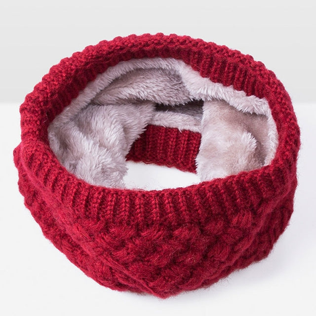 Red knit infinity scarf with thick ribbed texture and soft gray fleece lining