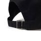 Black dad hat adjustable strap with shiny metal buckle