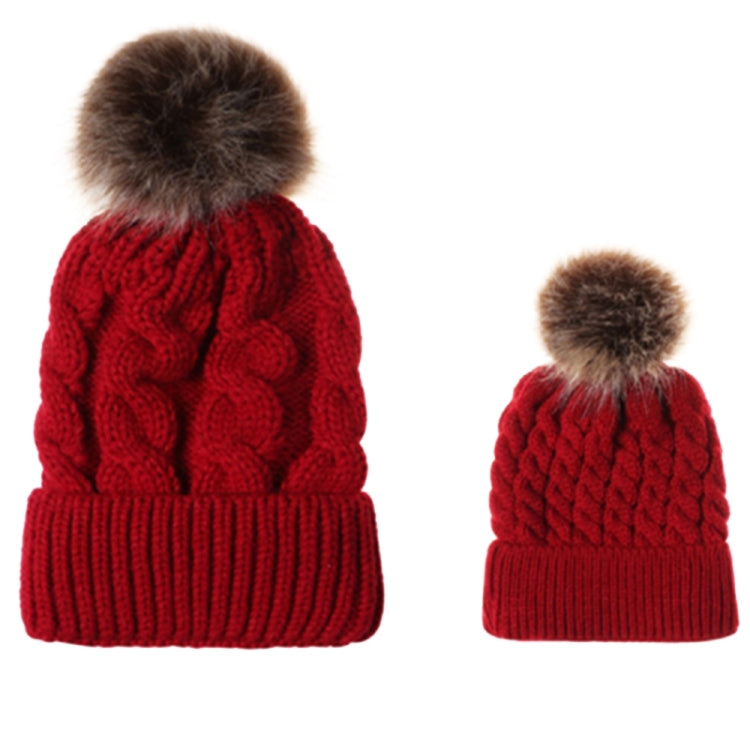 Parent-child knit beanie set in red with brown faux-fur pom pom and ribbed band