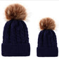 Parent-child knit beanie set in navy blue with brown faux-fur pom pom tops