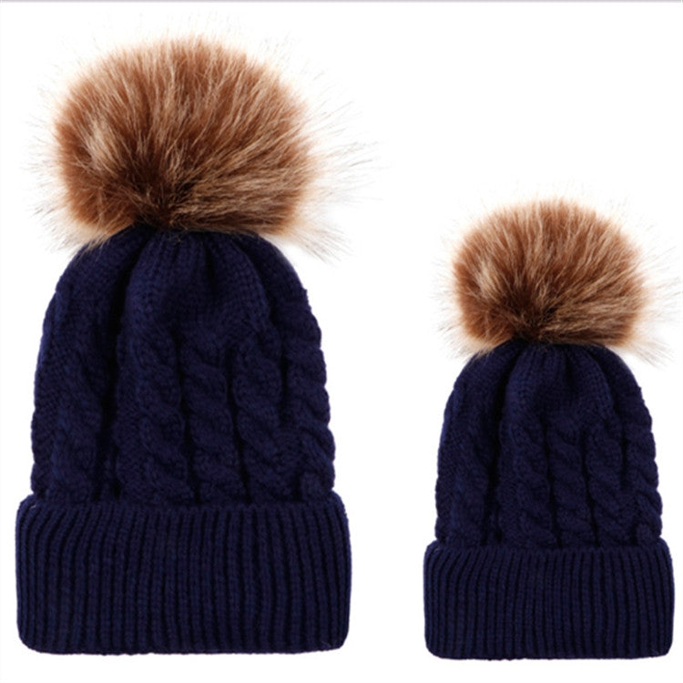 Parent-child knit beanie set in navy blue with brown faux-fur pom pom tops