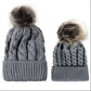 Parent-child knit beanie set in gray with brown faux-fur pom pom tops